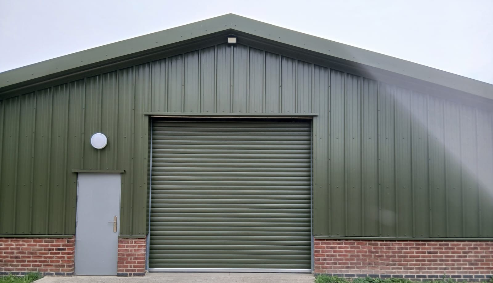 Industrial building with roller shutter door